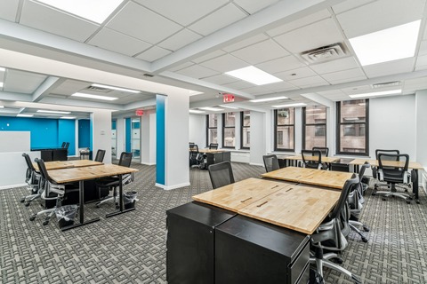 a room filled with furniture and a table in front of a building