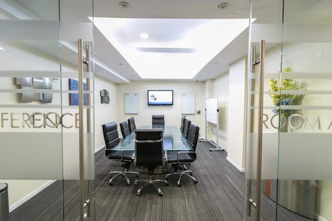a room filled with furniture and a large window