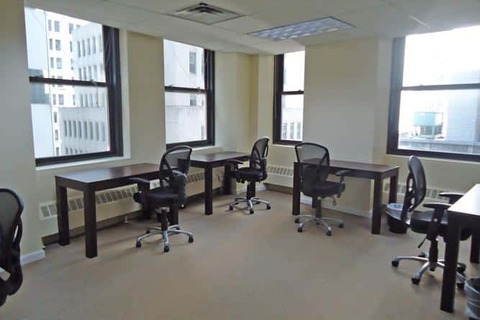 a room filled with furniture and a large window