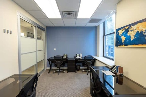 a room filled with furniture and a large window