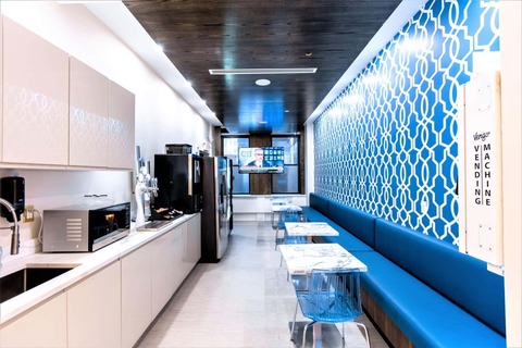 a kitchen with a blue background