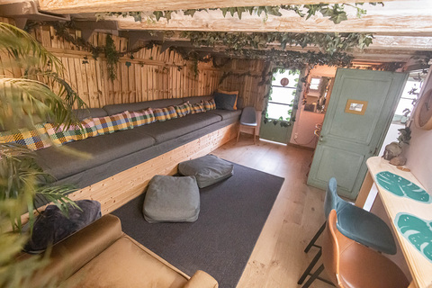 a room with a couch and pillows
