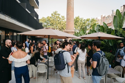 a group of people standing in front of a building