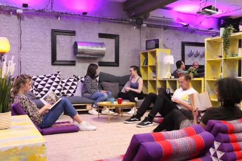 a group of people sitting at a table in a room