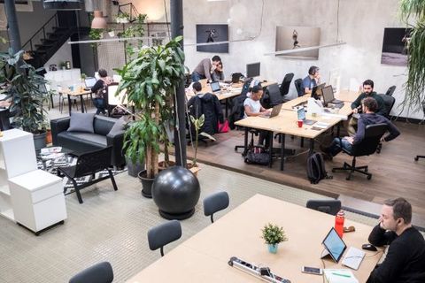 a group of people sitting at a table in a room