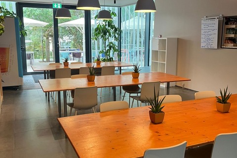 a room with tables and chairs