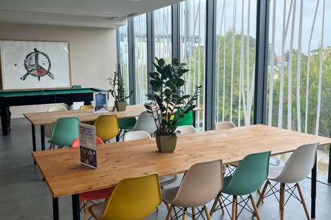 a room with a table and chairs