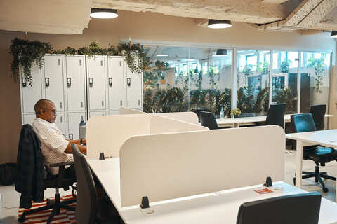 a man sitting at a desk in an office