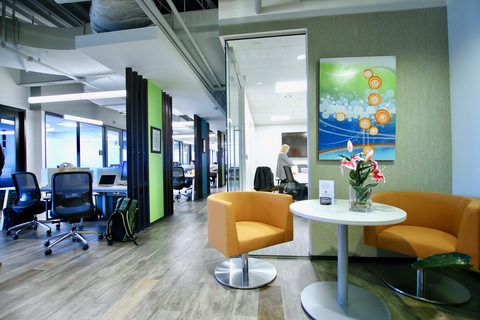 an office with a desk and chair in a room