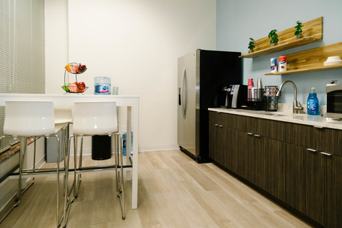 a kitchen with a sink and a refrigerator