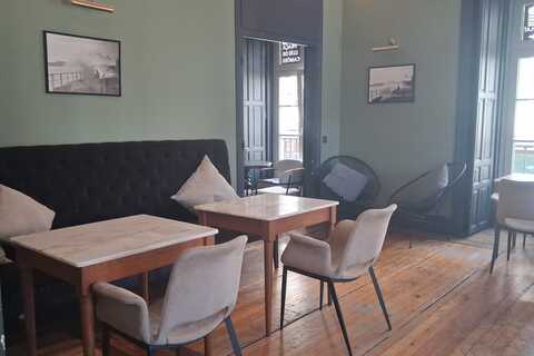 a room with a couch and tables