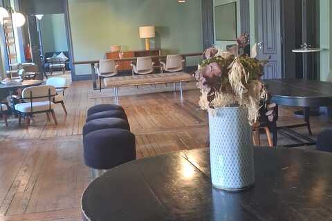 a room with a table and chairs