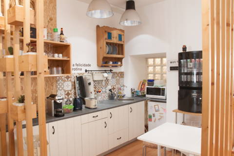a kitchen with a sink and a mirror