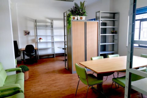 a room filled with furniture and a large window