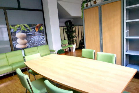 a green chair at a table