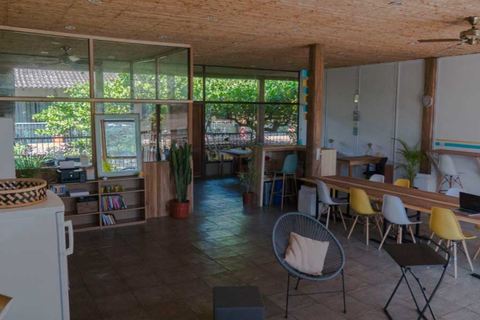 a room filled with furniture and a large window