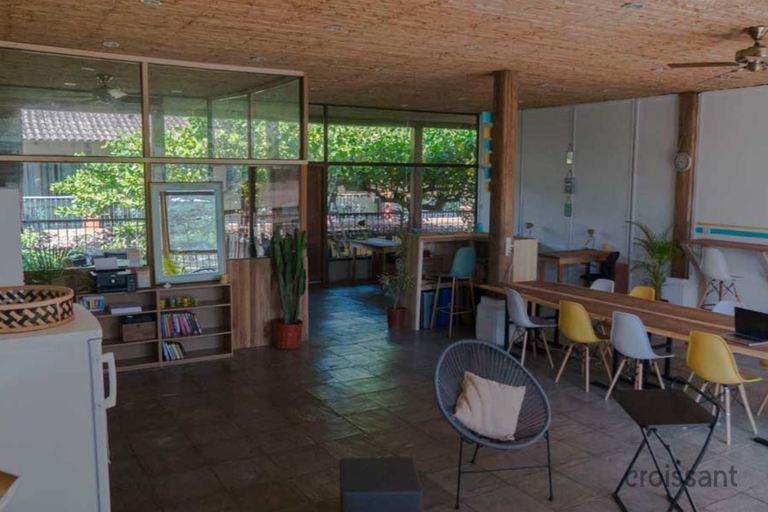 a room filled with furniture and a large window