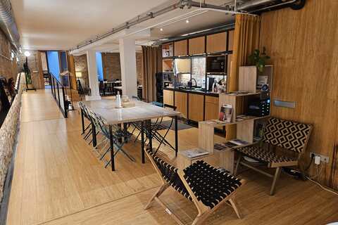 a room filled with furniture next to a chair