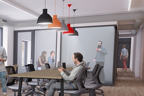 a group of people sitting at a table in a room