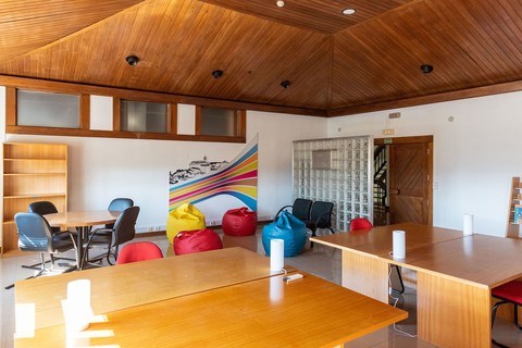a living room filled with furniture on top of a wooden table