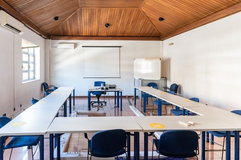 an office with a desk and chair in a room