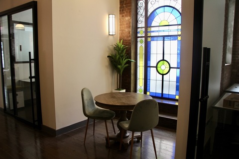 a room that has a clock on a table