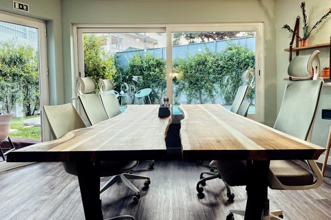 a room filled with furniture and a large window