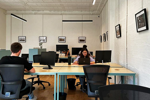an office with a desk and chair in a room
