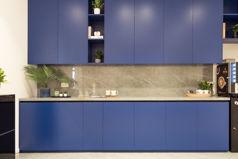 a kitchen with a blue background