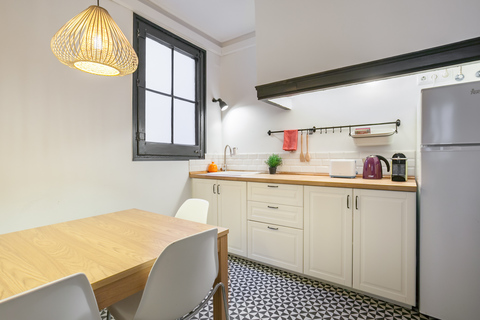a kitchen with a table in a room