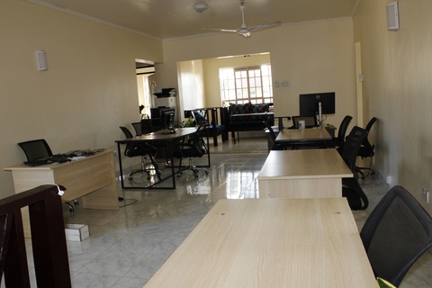 a living room filled with furniture and a table