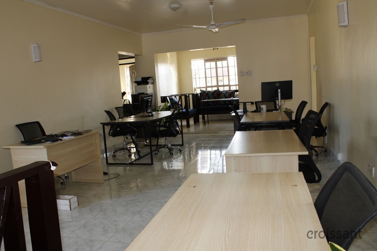 a living room filled with furniture and a table