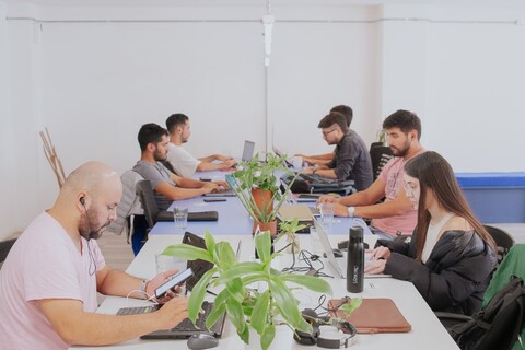 a group of people sitting at a table