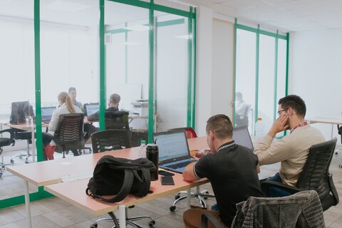 a group of people standing in a room