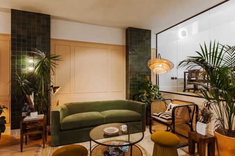 a living room filled with furniture and a fire place