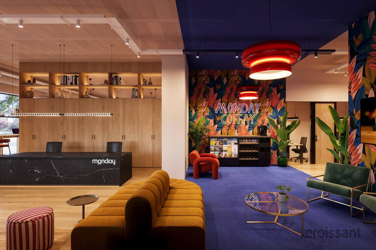 a living room filled with furniture and a large window
