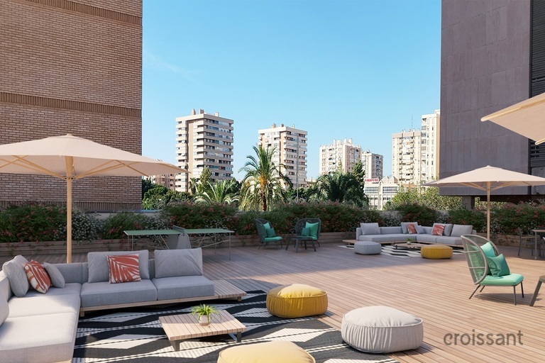 a living area with a building in the background