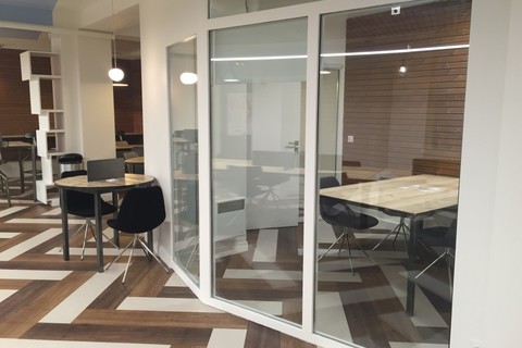 a room filled with furniture and a large window