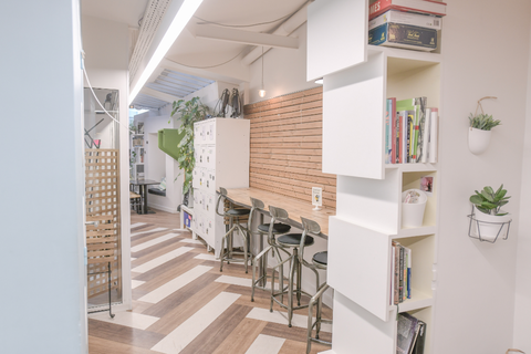 a room filled with furniture and a refrigerator
