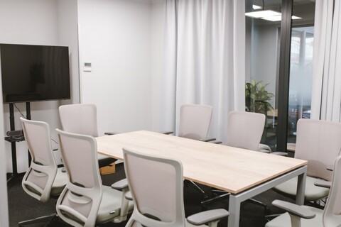a bedroom with a desk and chair in a room