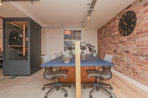 a room with a table and chairs