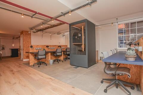 a room with a table and chairs