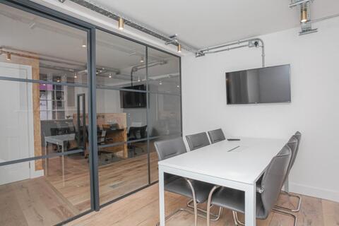 a room with a table and chairs