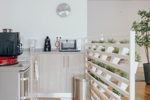 a kitchen with a sink and a mirror