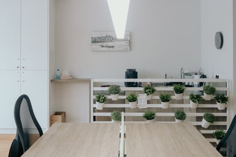 a room filled with furniture and a mirror