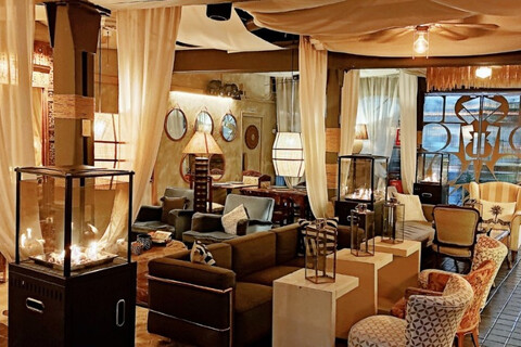 a room filled with furniture and a fireplace