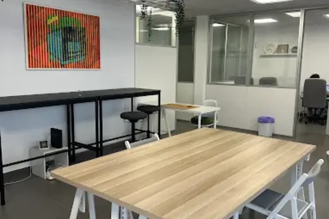 a room with a table and chairs