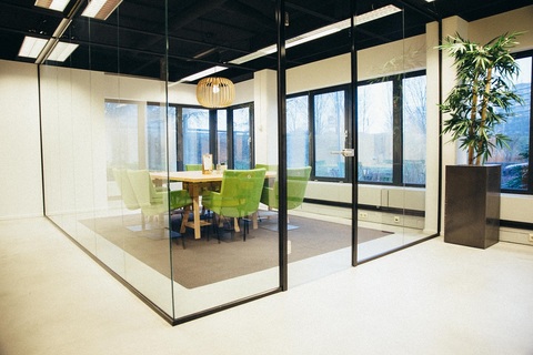 a room filled with furniture and a large window