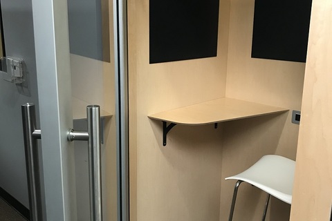 a room with a sink and a mirror