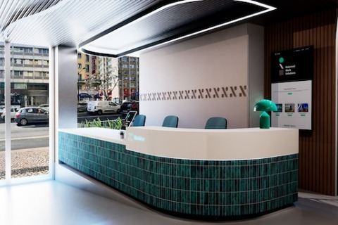 a kitchen with green walls